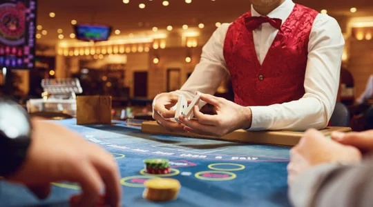 Croupier deals cards during blackCaptain jackpots